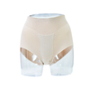 Beige shapewear shorts on a clear background